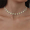 Gold necklace with a daisy