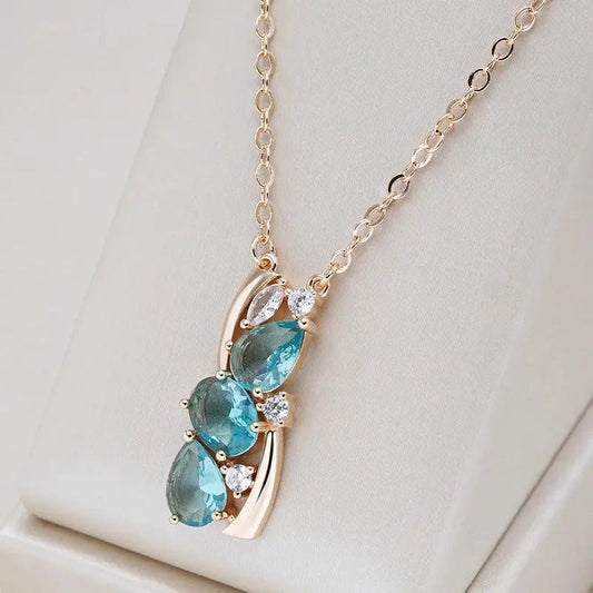 Elegant gold necklace with blue crystals