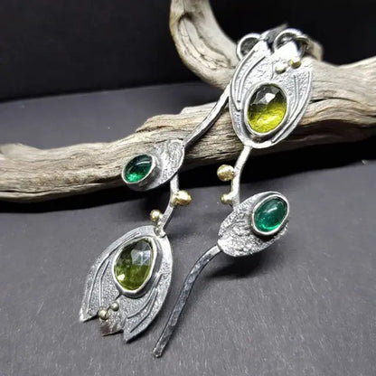 Boho earrings with green stones in silver setting