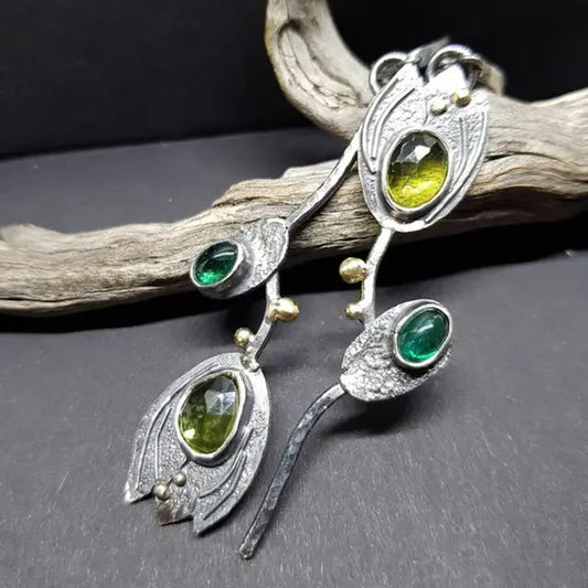 Boho earrings with green stones in silver setting