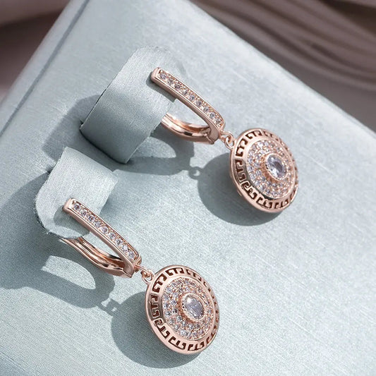 Elegant round earrings with light-colored cubic zirconia
