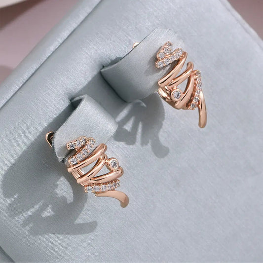 Elegant spiral earrings in light gold color