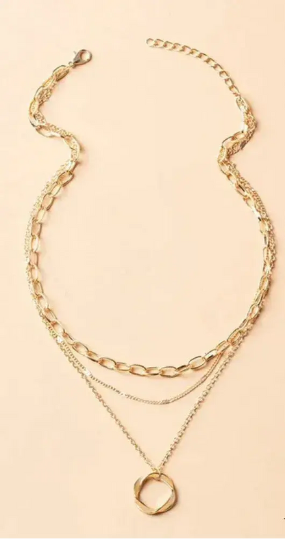 Gold necklace with chain and pendant in vintage style