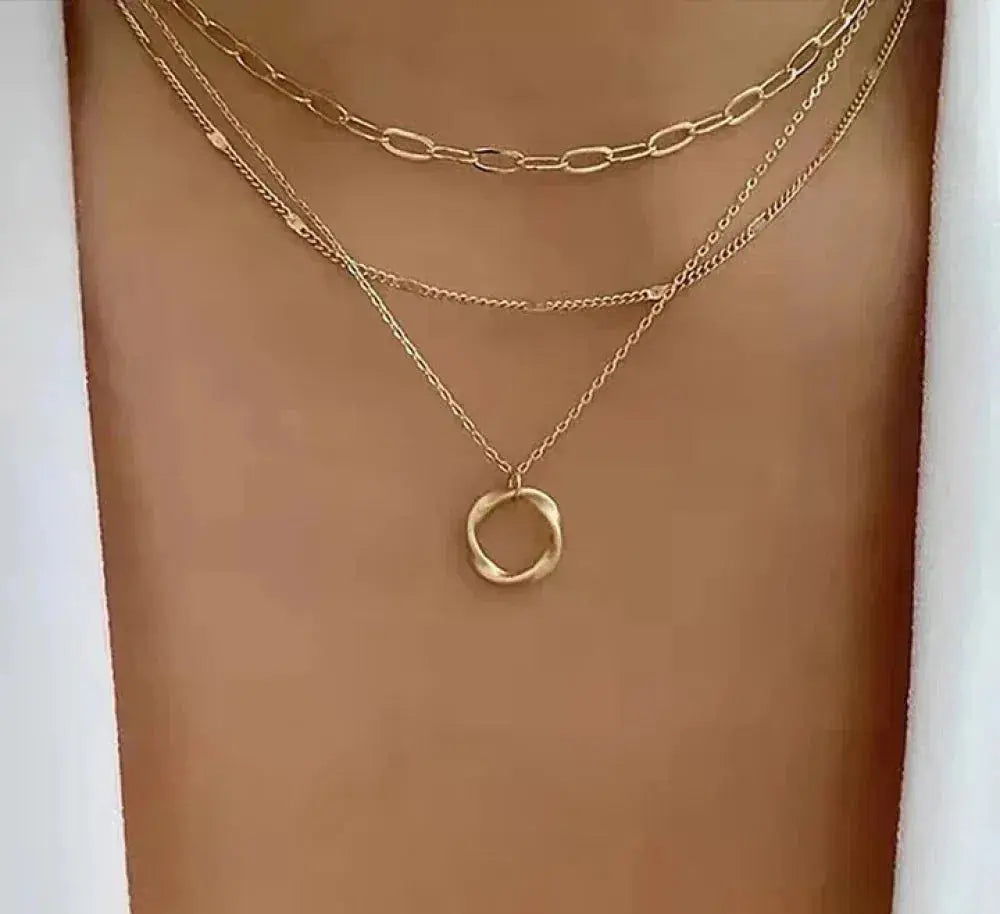 Gold necklace with chain and pendant in vintage style